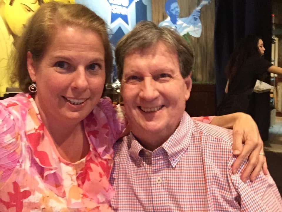 A man and woman smiling for a picture