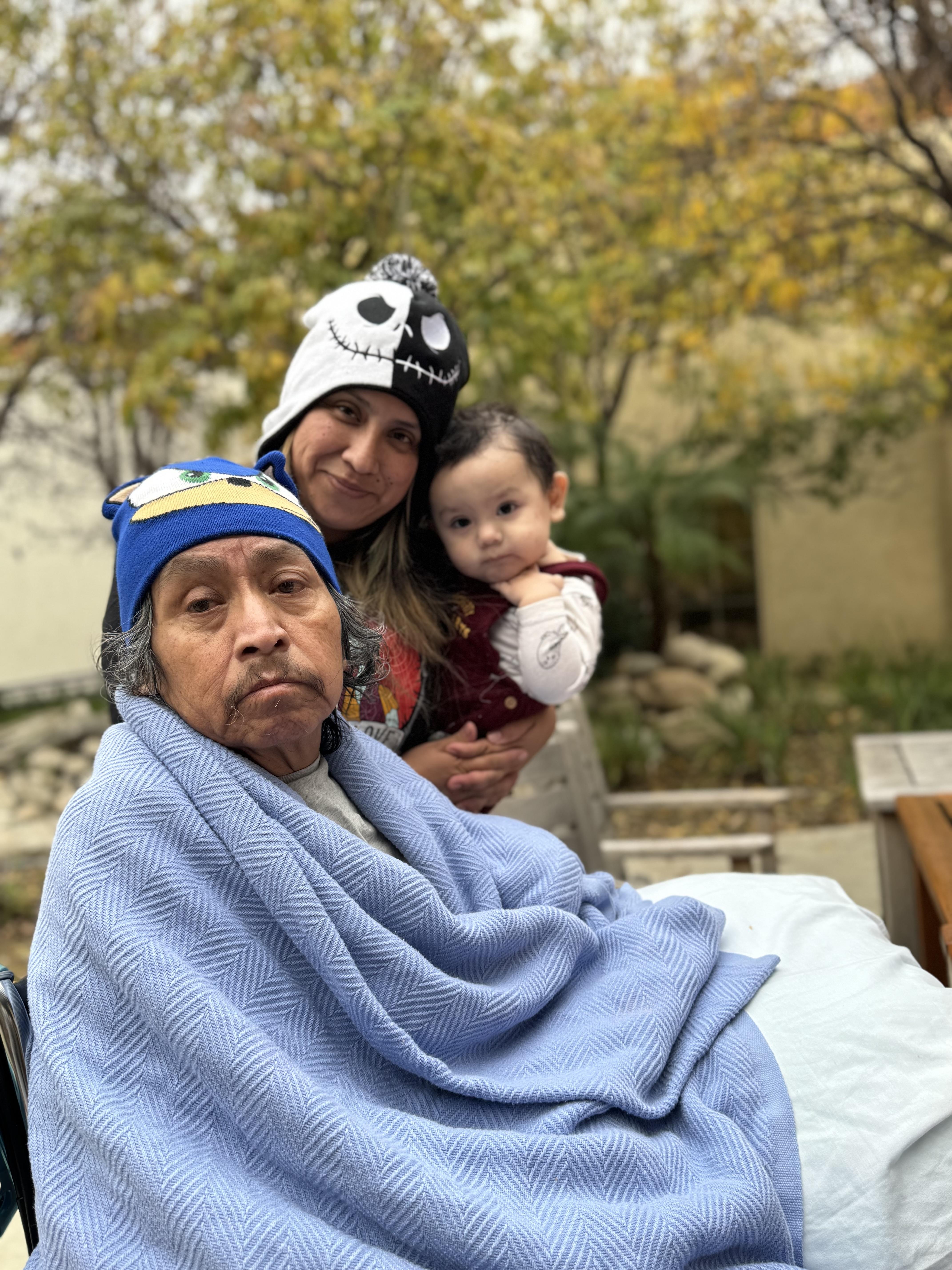 A woman and a man with a baby