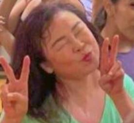 A woman making a face with her hands