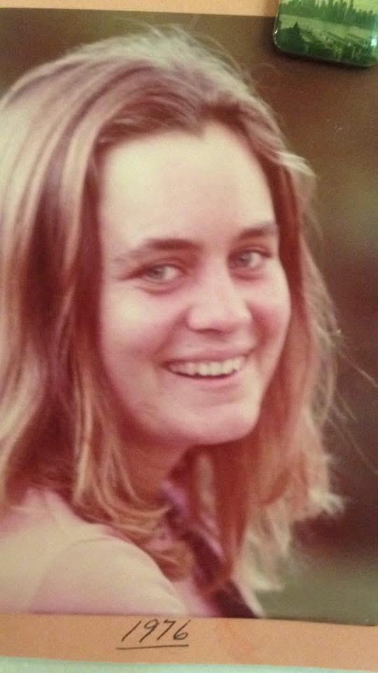 A woman smiling at the camera