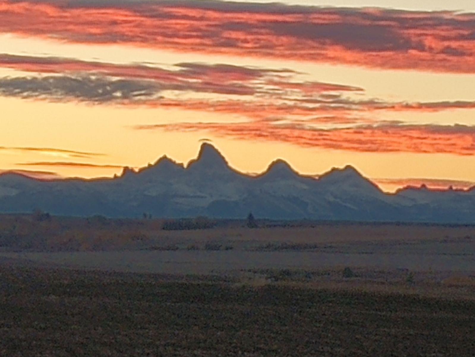 A sunset over a mountain range