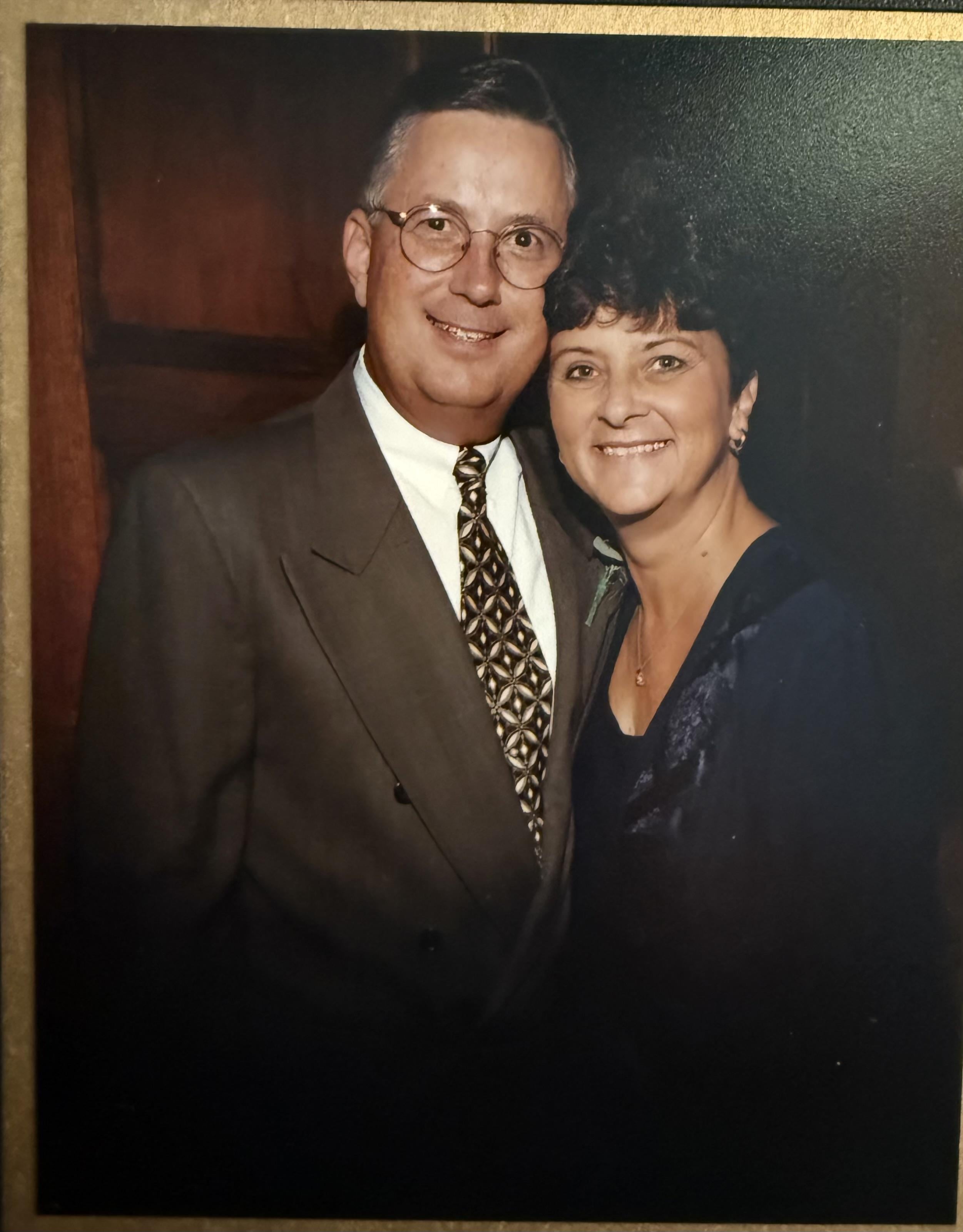 A man and woman posing for a picture