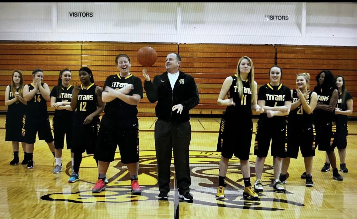 A coach with a basketball team