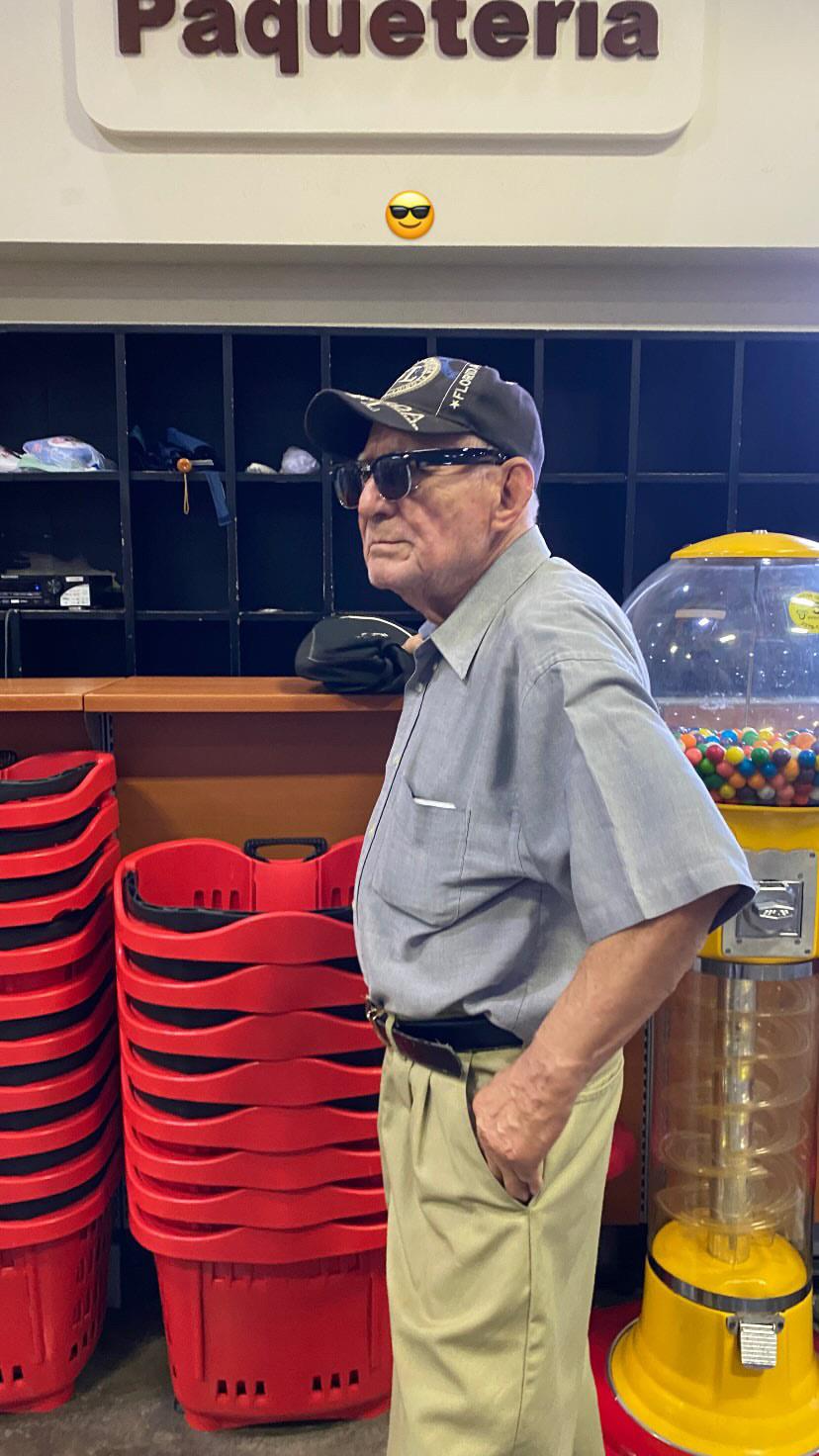 An old man in a hat and sunglasses