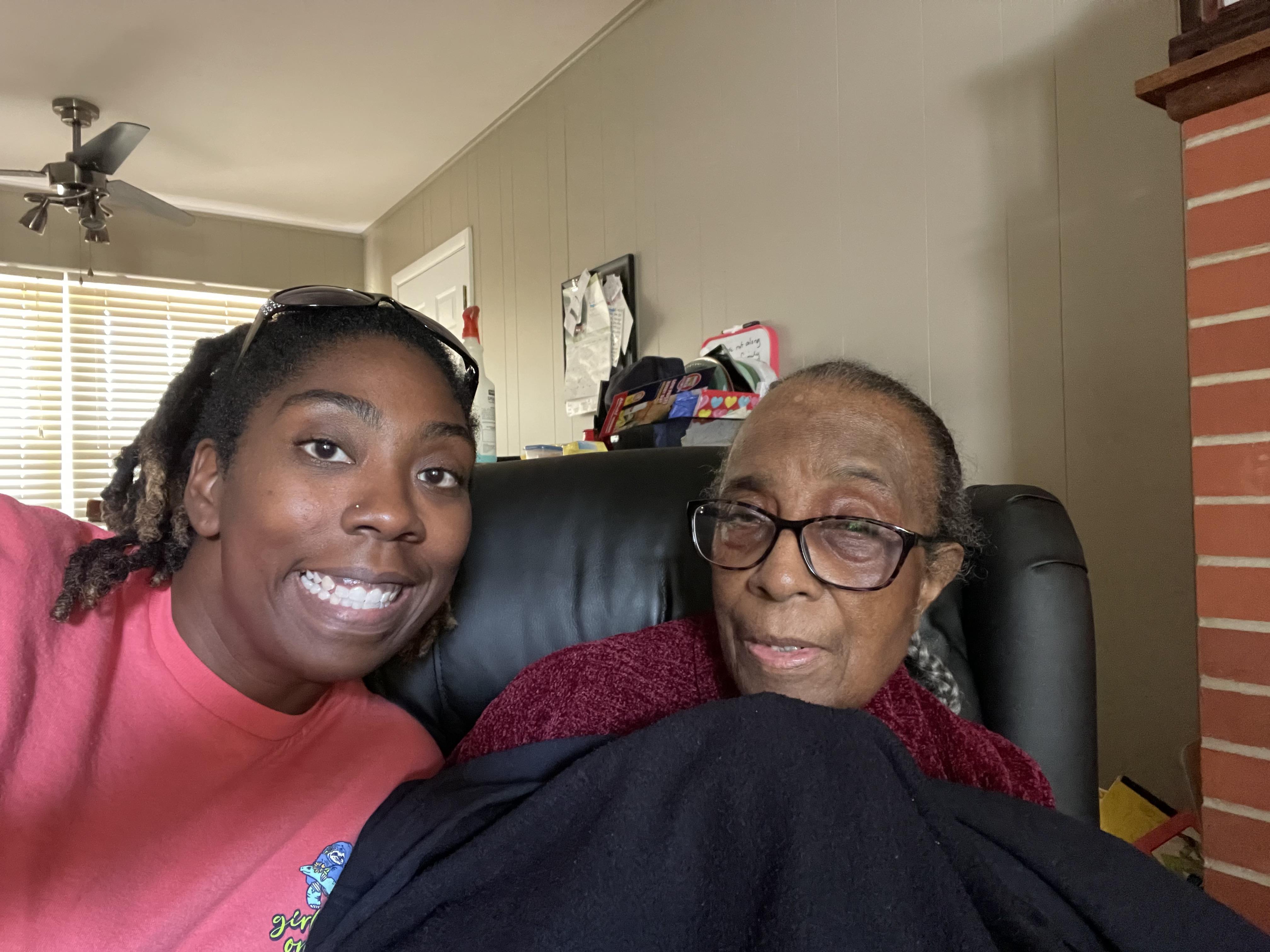 A woman and a woman sitting on a couch