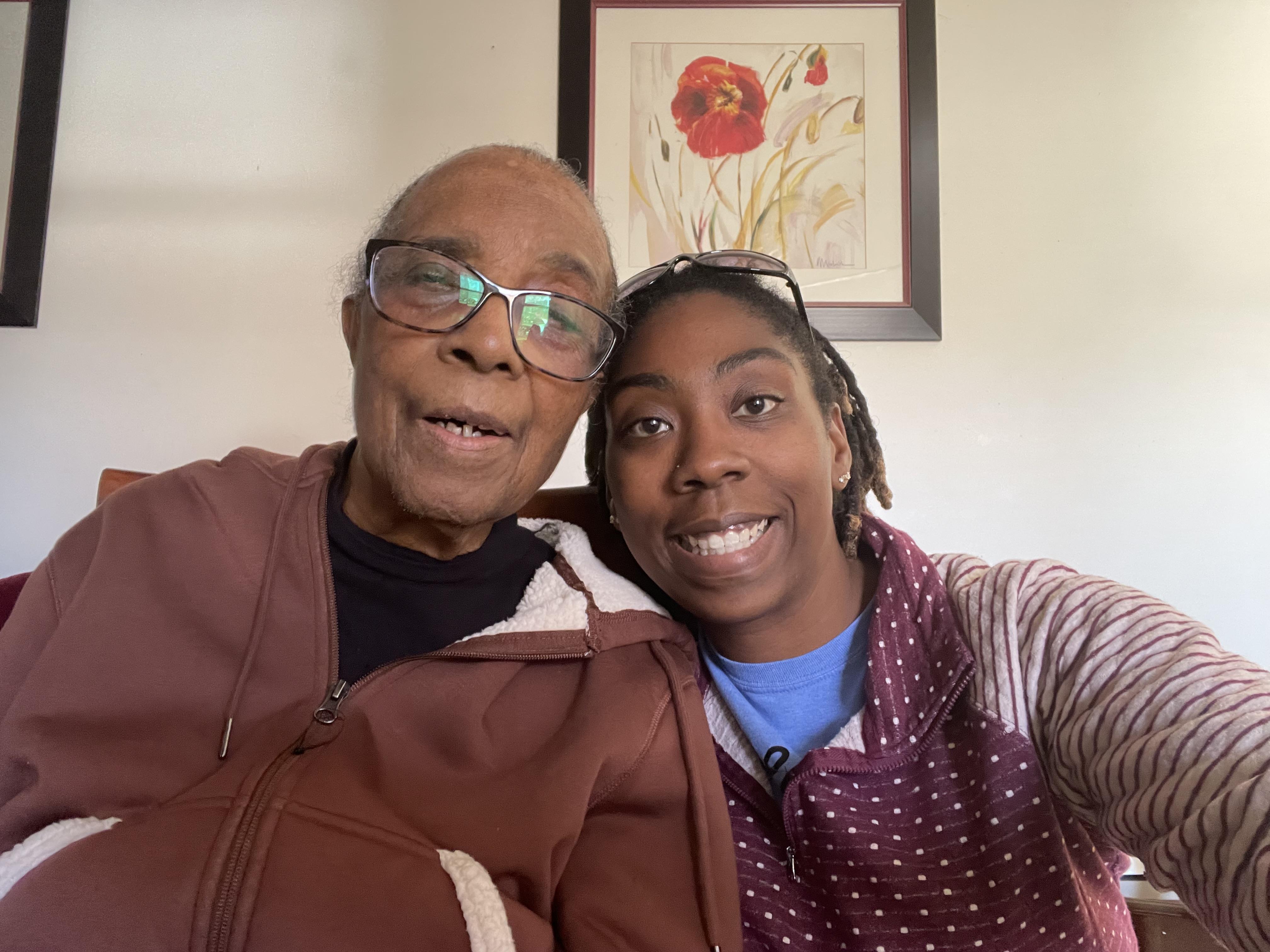 A woman and a woman taking a selfie