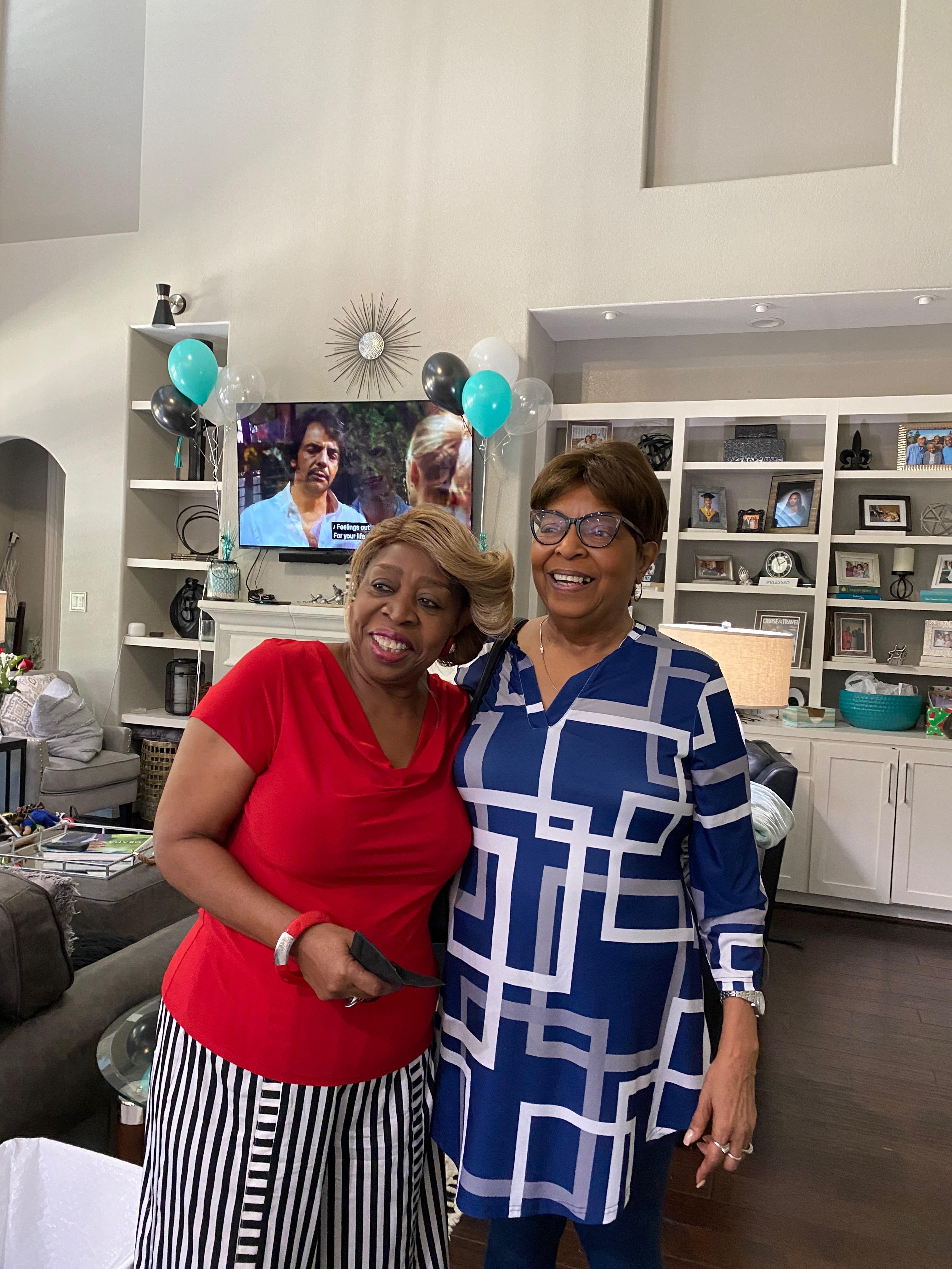 Two women standing in a room
