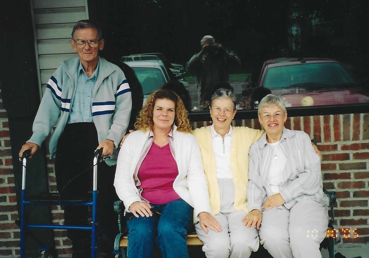 A group of people sitting on a bench