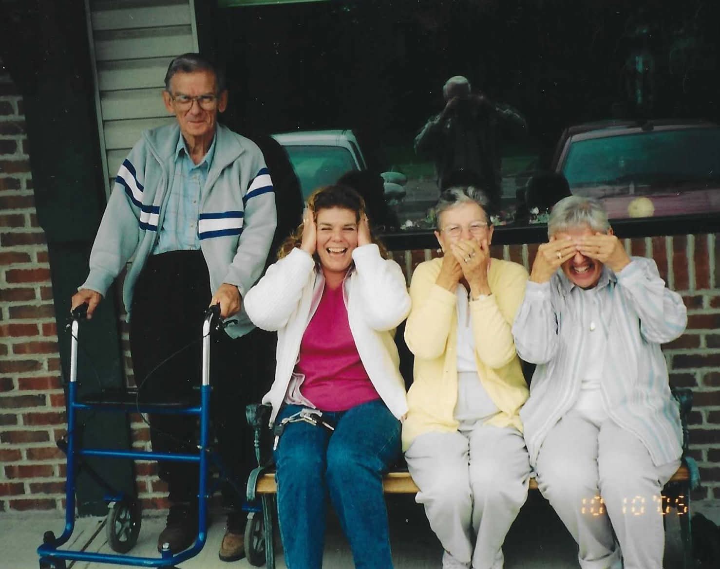 A group of people sitting on a bench