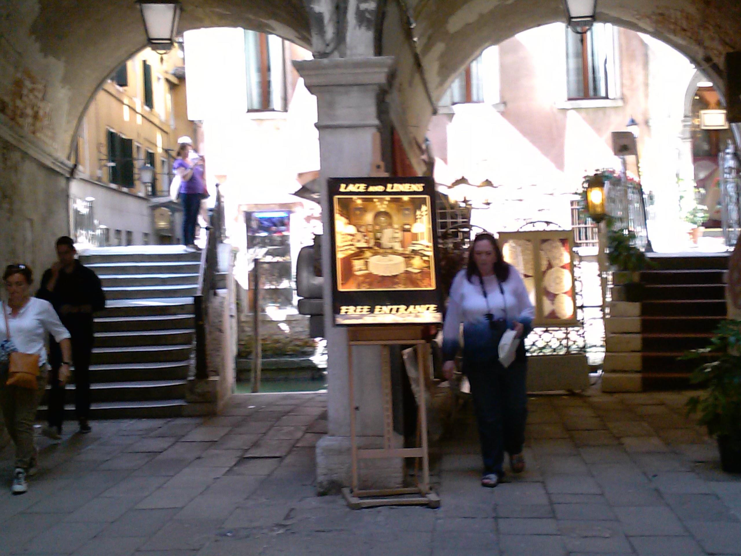 A woman walking in a courtyard