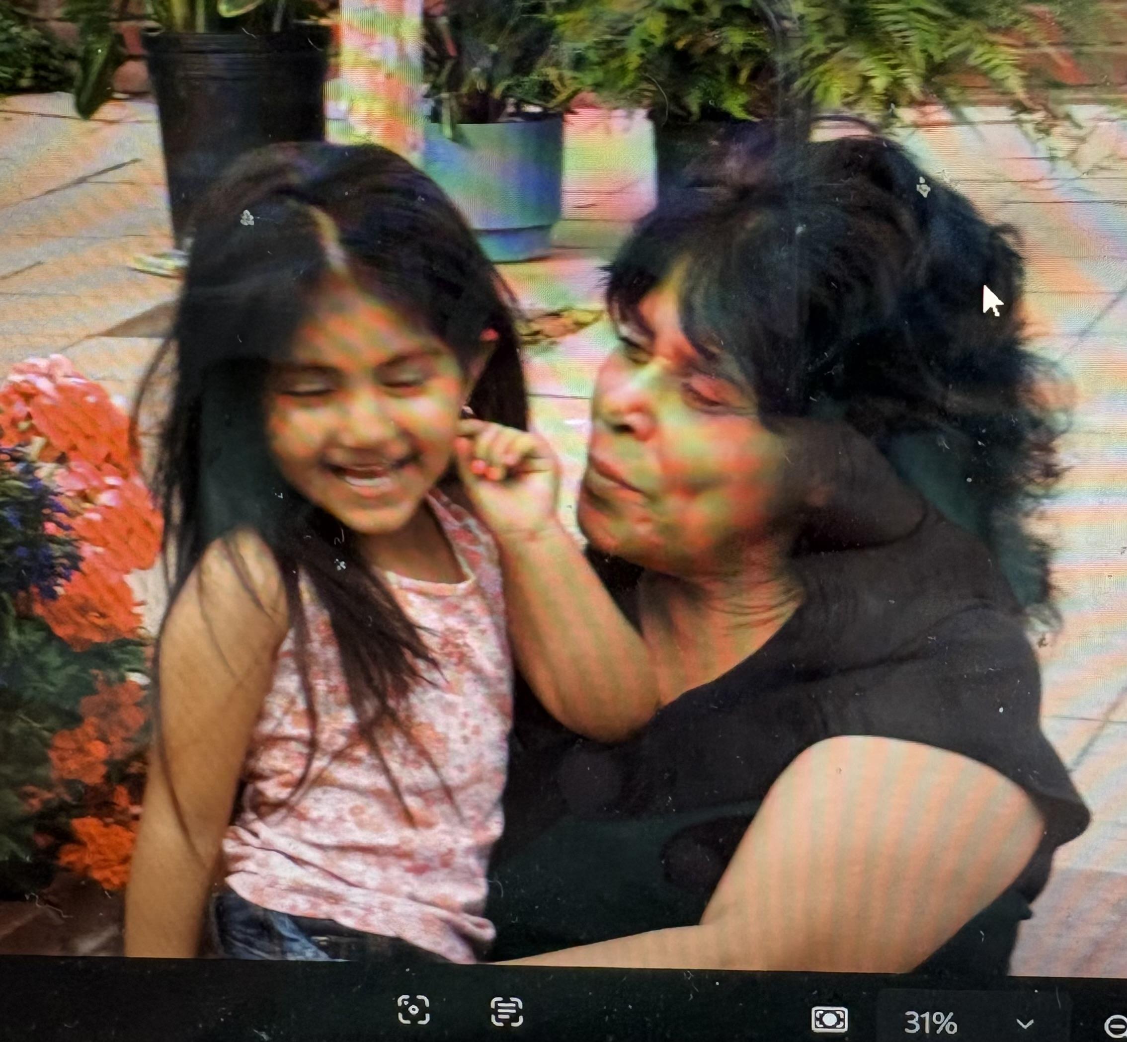 A woman holding a girl
