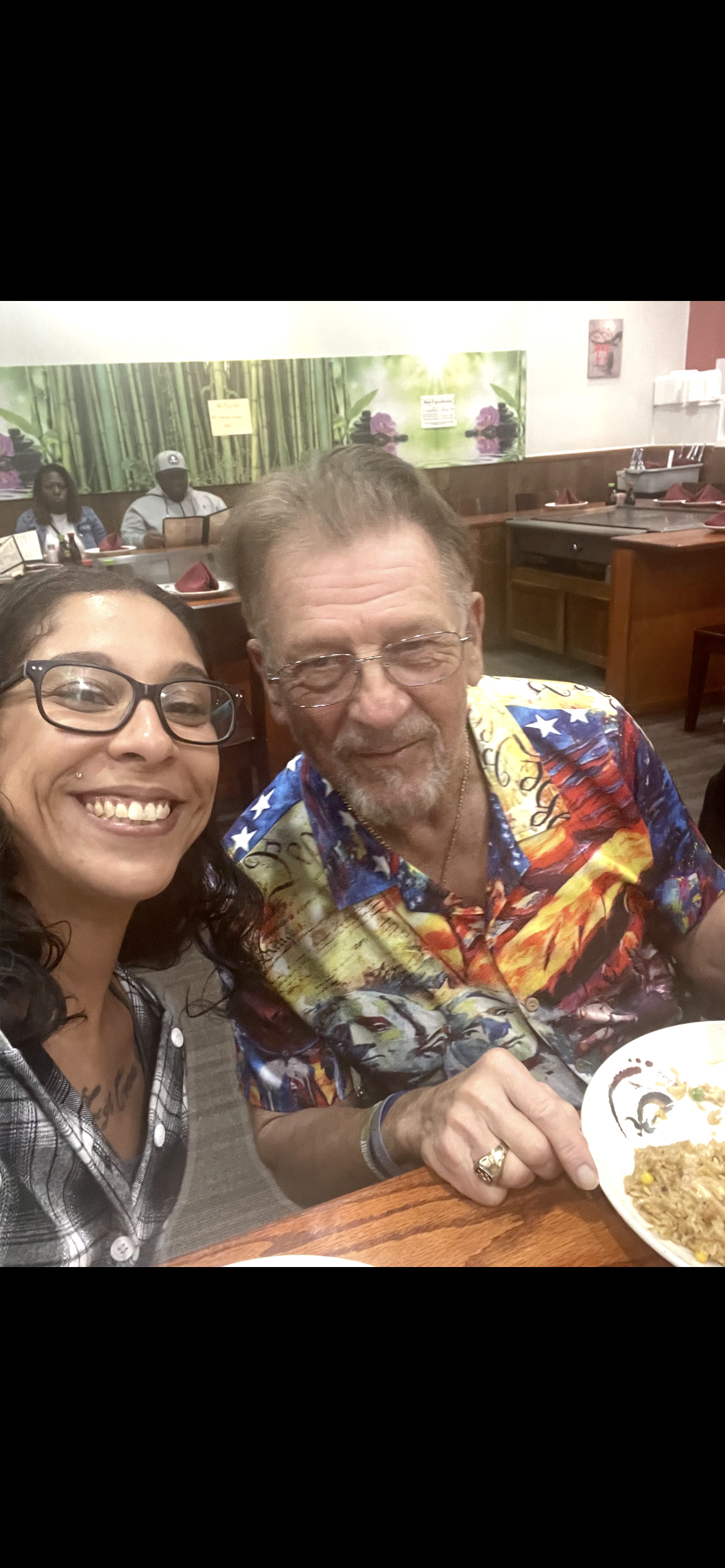 A woman smiling next to a man