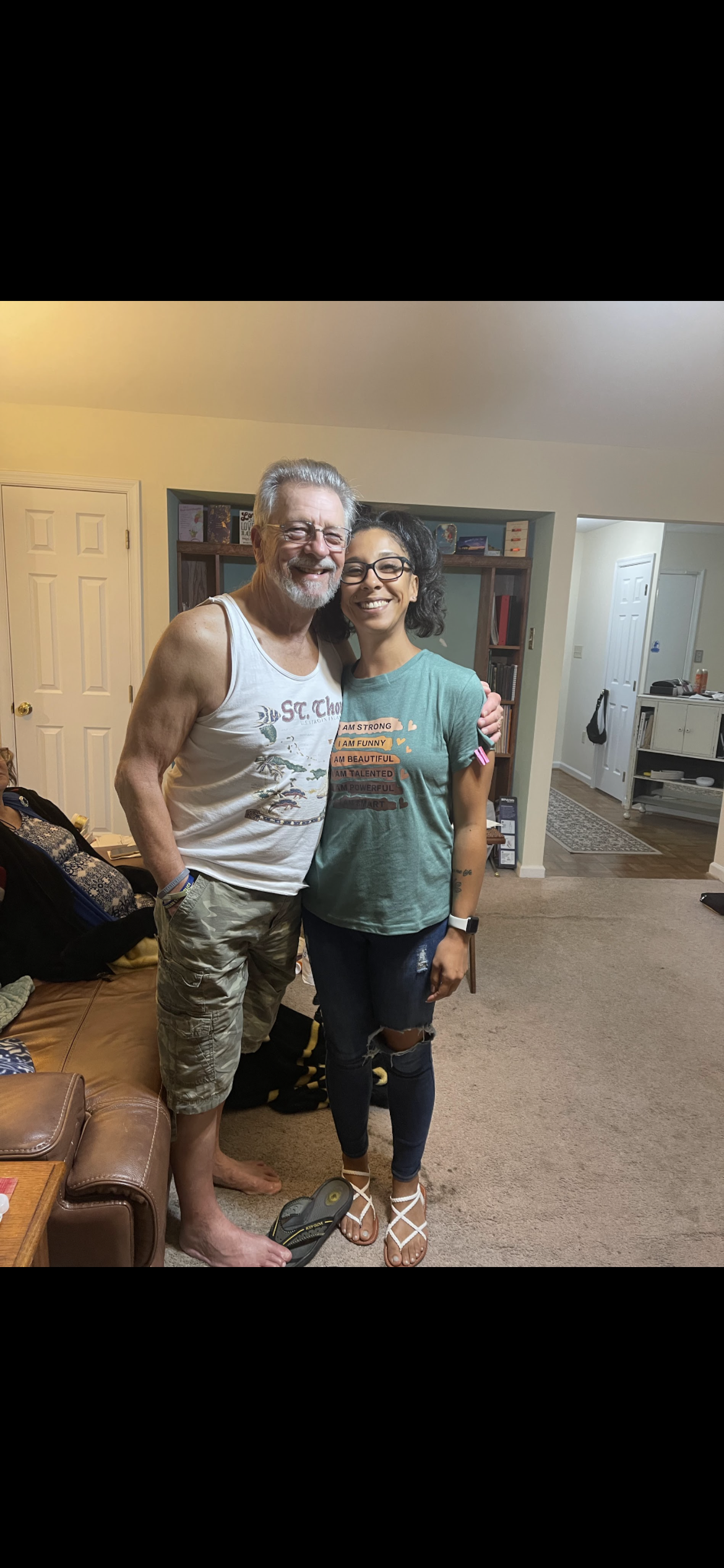 A man and woman posing for a picture