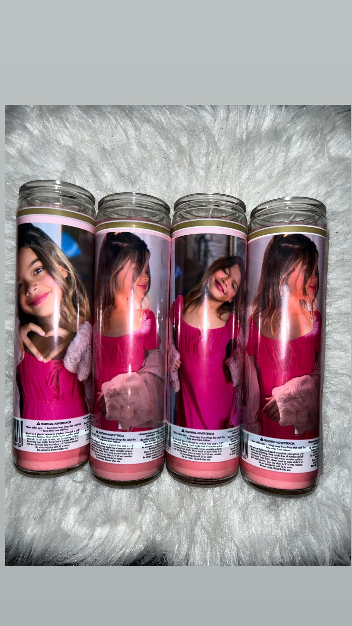 A group of candles with a picture of a girl