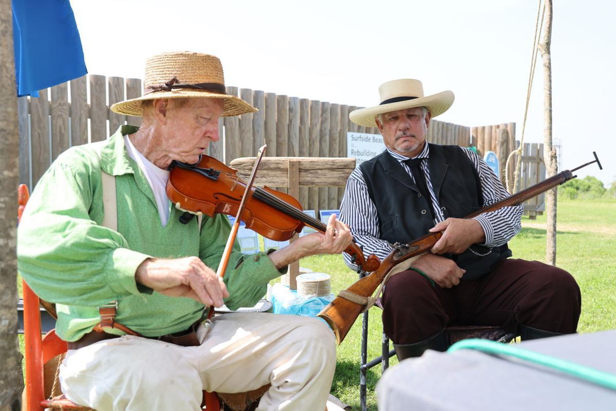 A group of men playing violin