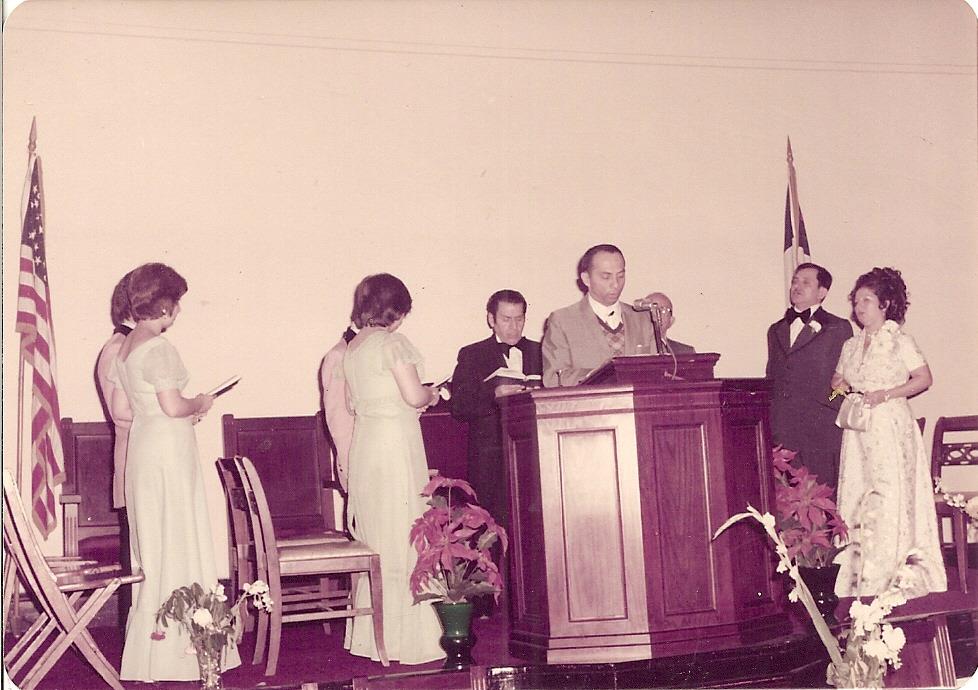 A group of people standing at a podium