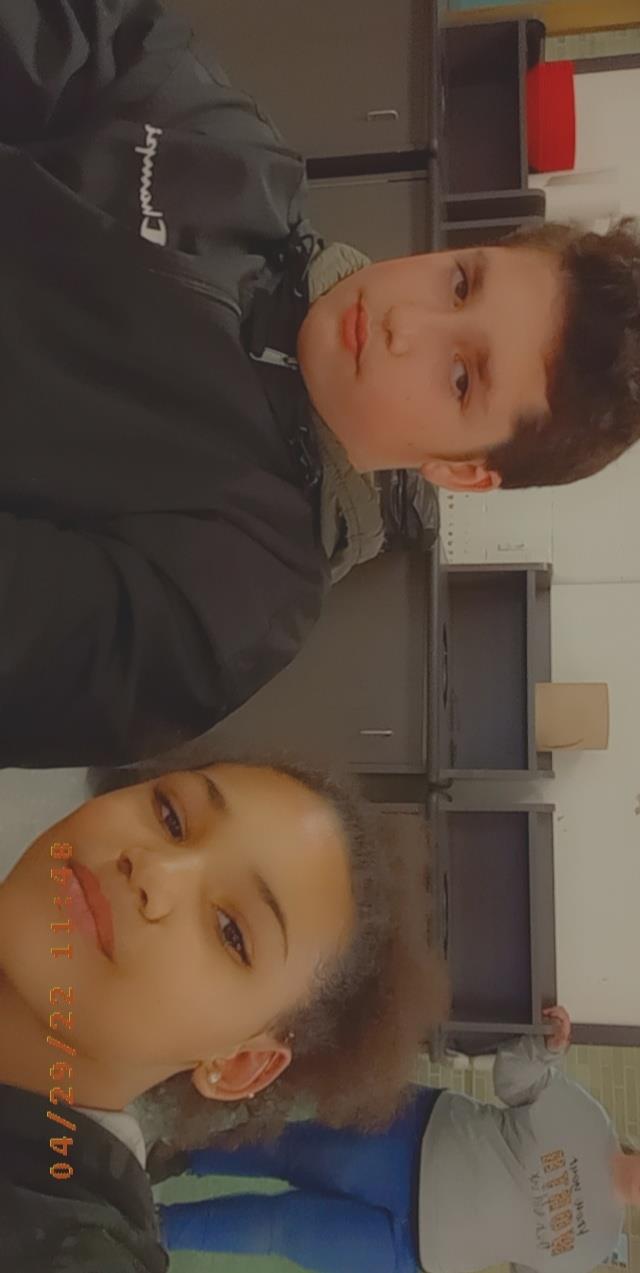 A boy and girl taking a selfie