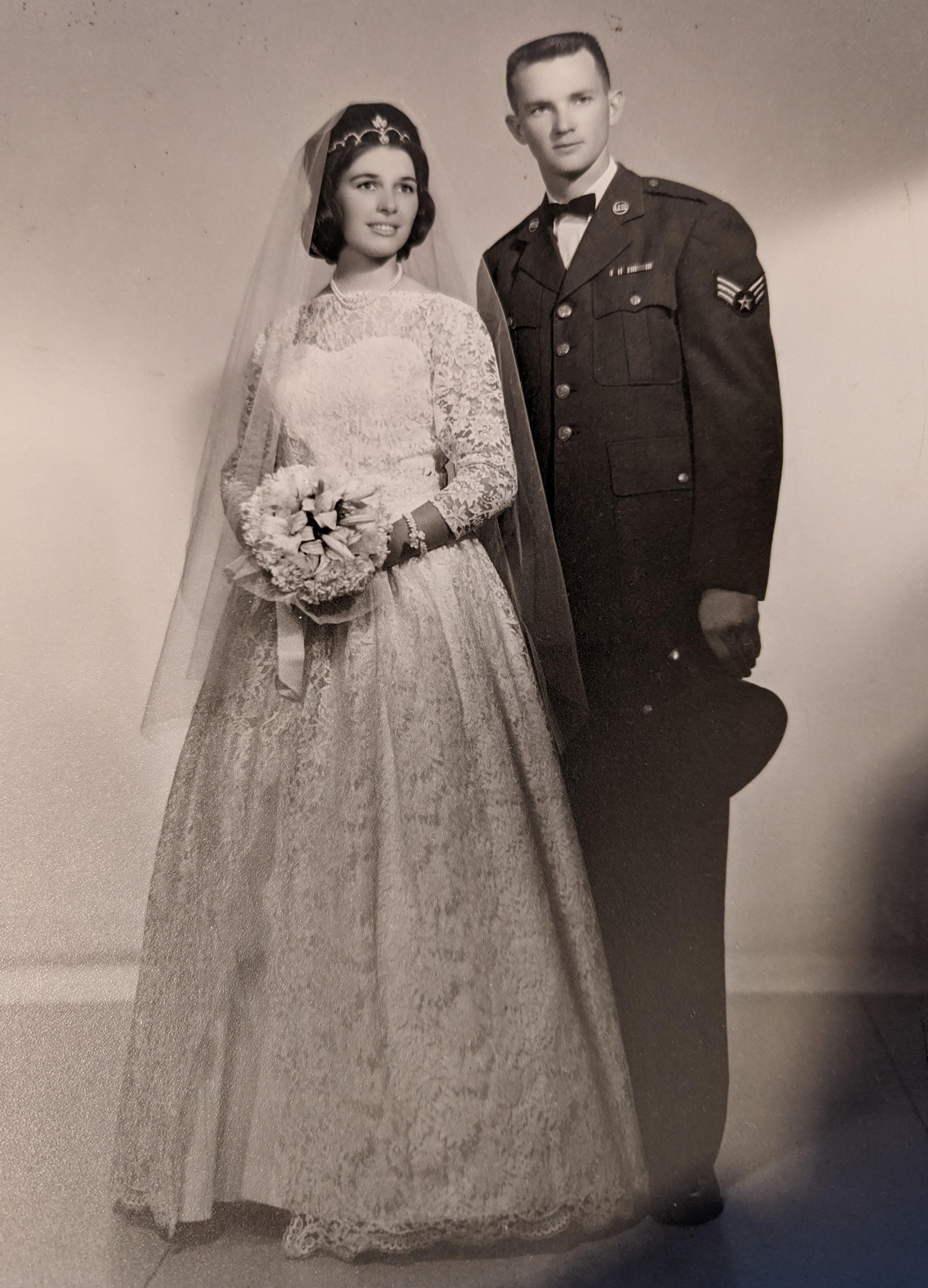 A man and woman in wedding attire