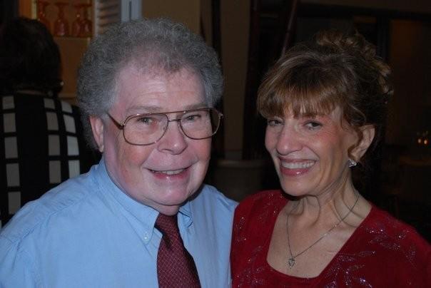 A man and woman smiling for a picture