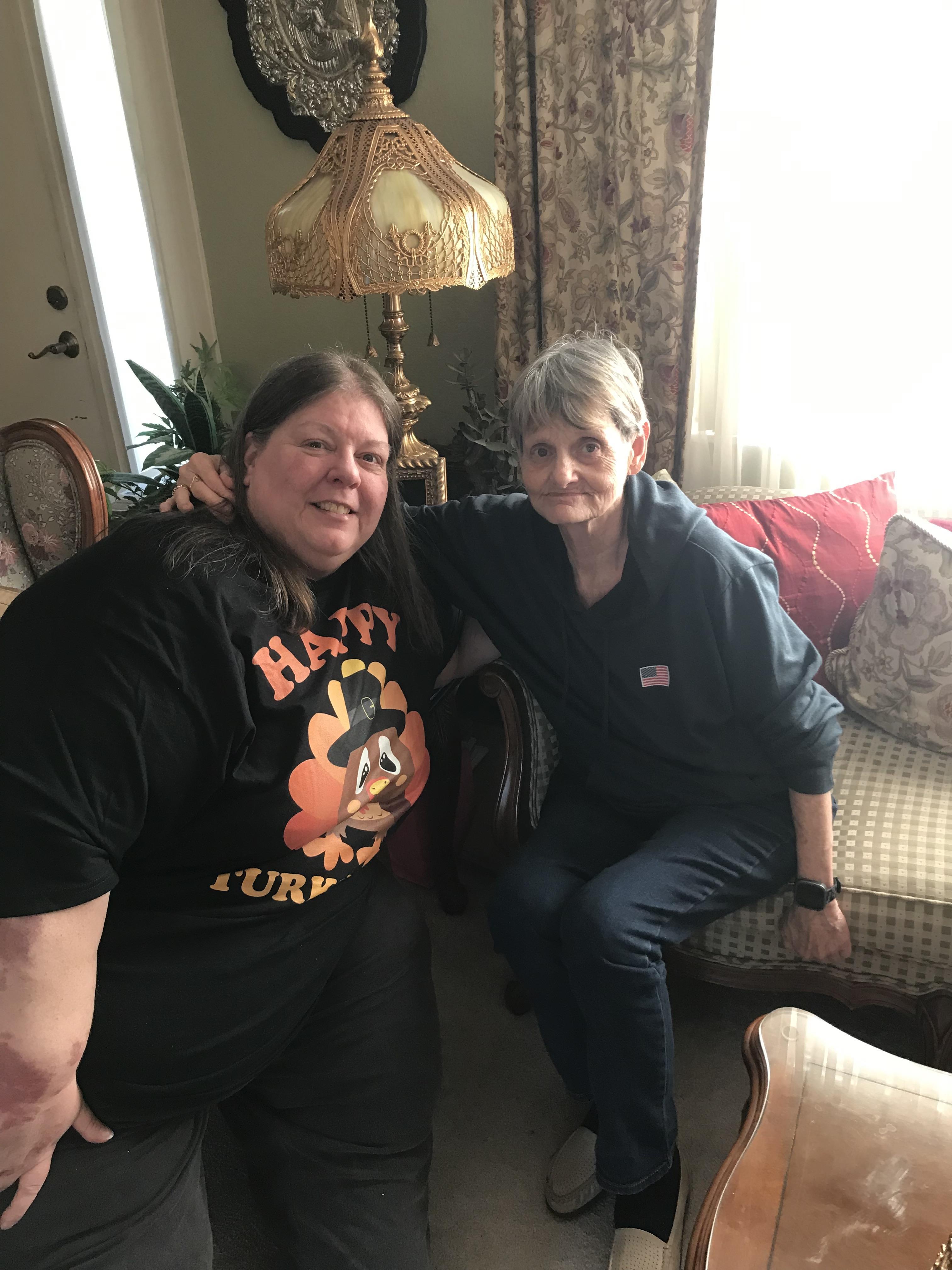 Two women sitting on a couch