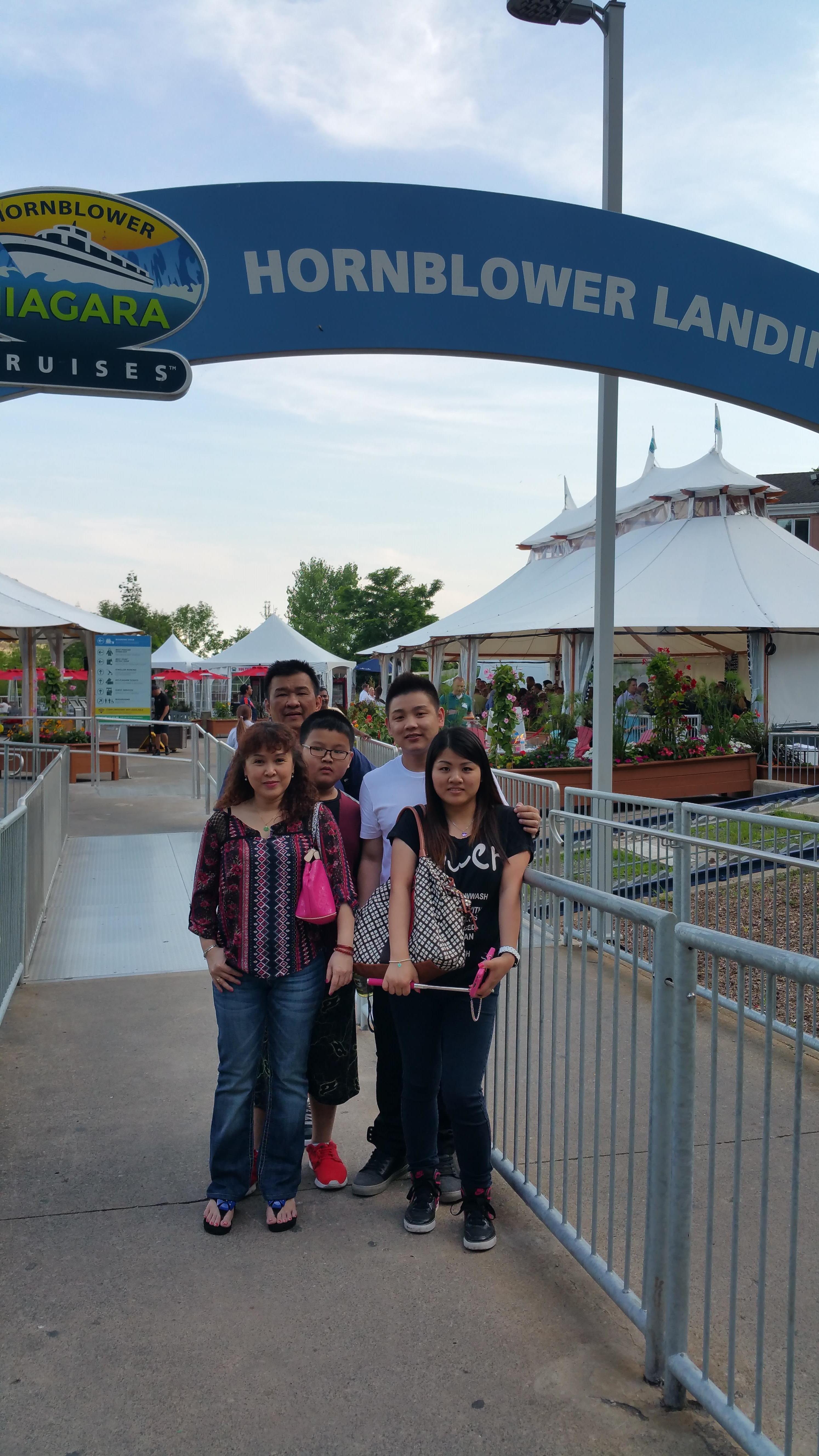 A group of people standing under a gate
