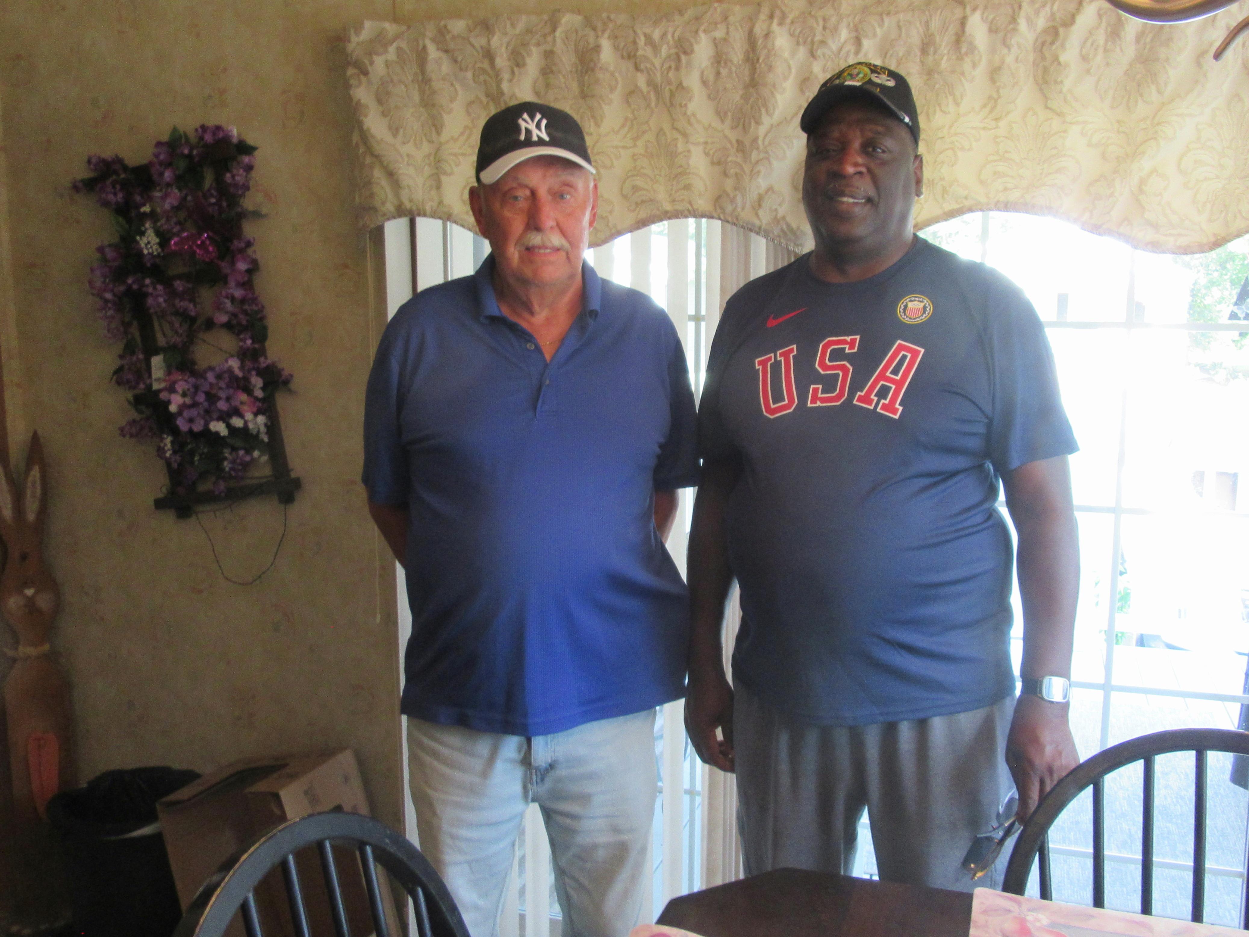 Two men standing in a room