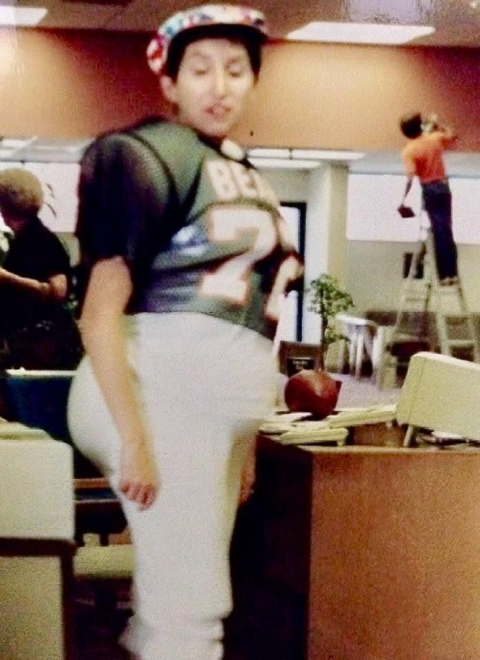 A woman in a football jersey