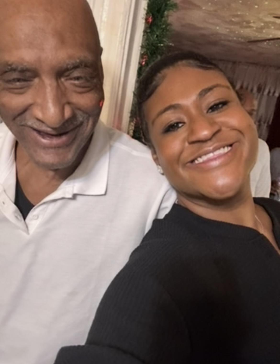 A man and woman smiling for a selfie