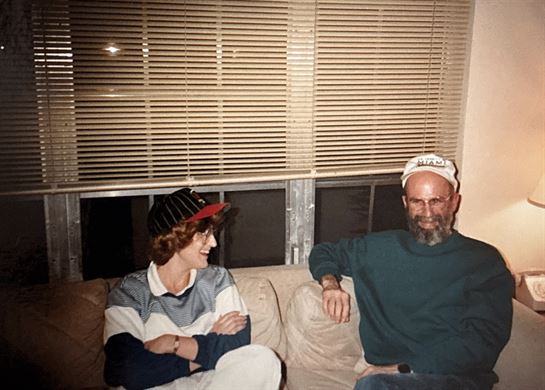 A man and woman sitting on a couch