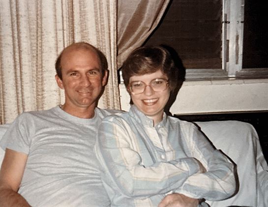 A man and woman sitting on a couch