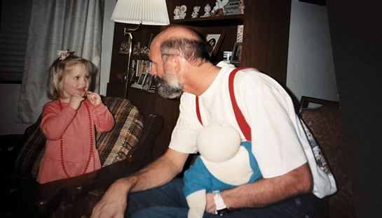 A man holding a doll