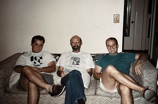 A group of men sitting on a couch