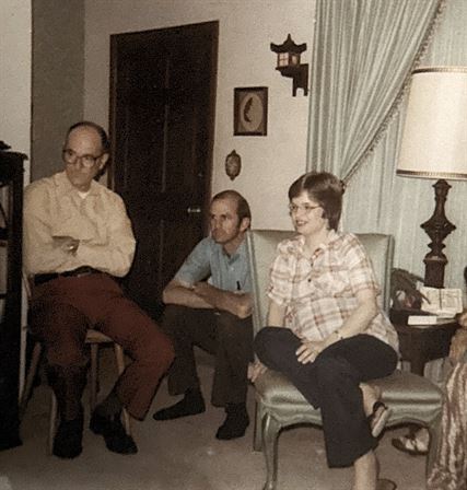 A group of people sitting in chairs