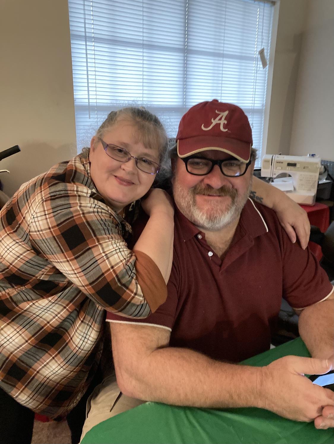 A man and woman posing for a picture