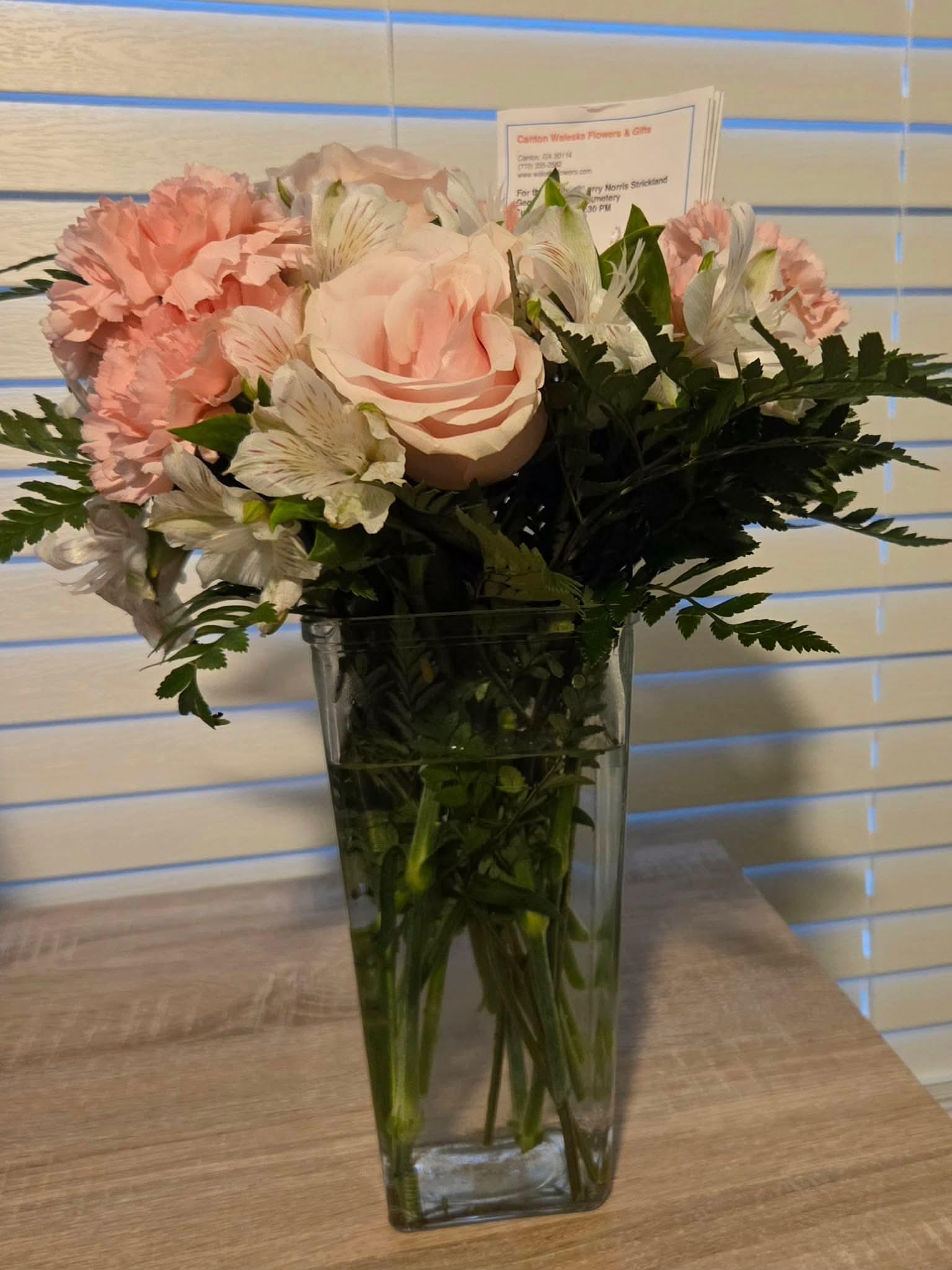 A vase of flowers on a table
