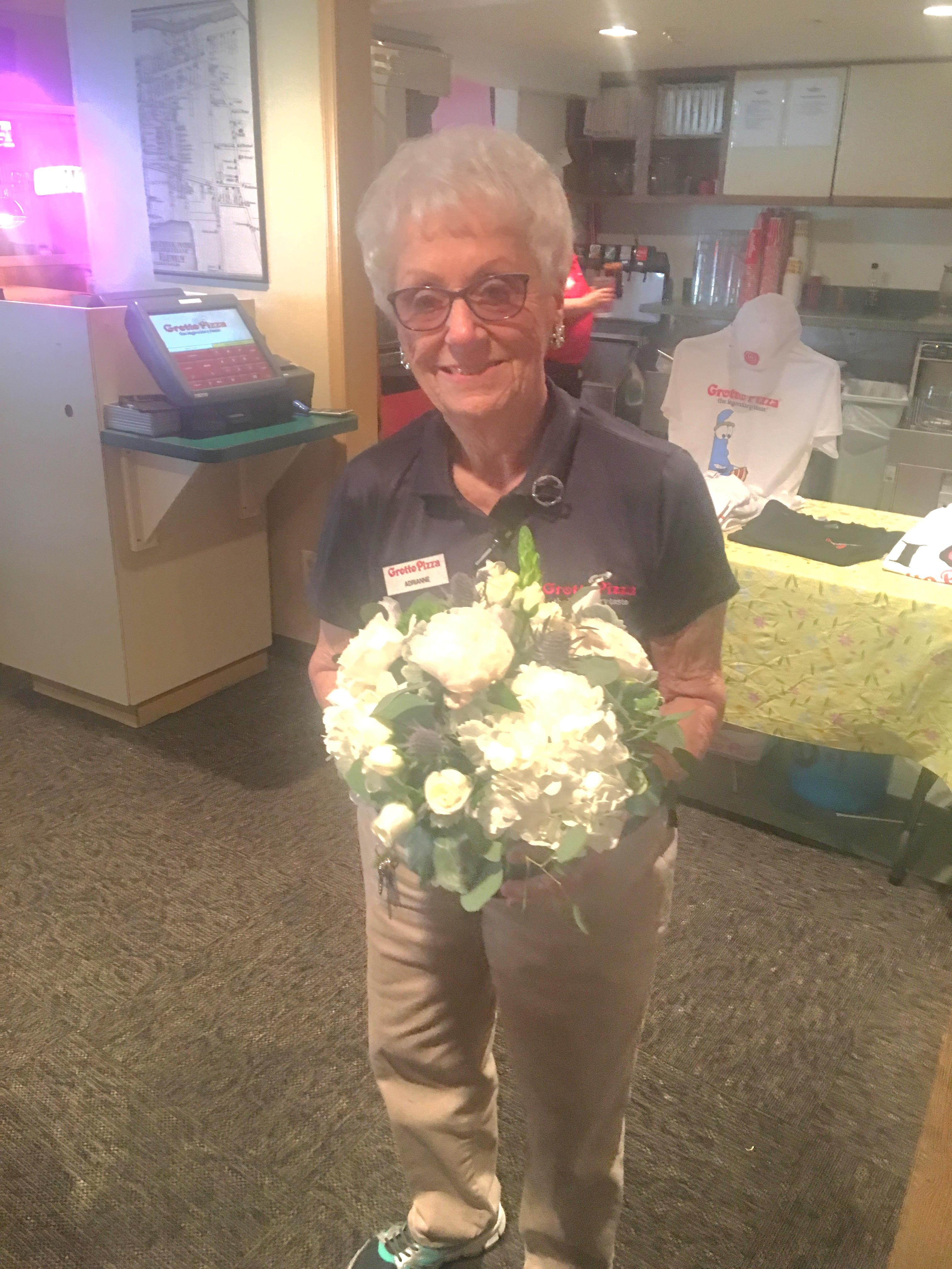 A woman holding a bouquet of flowers