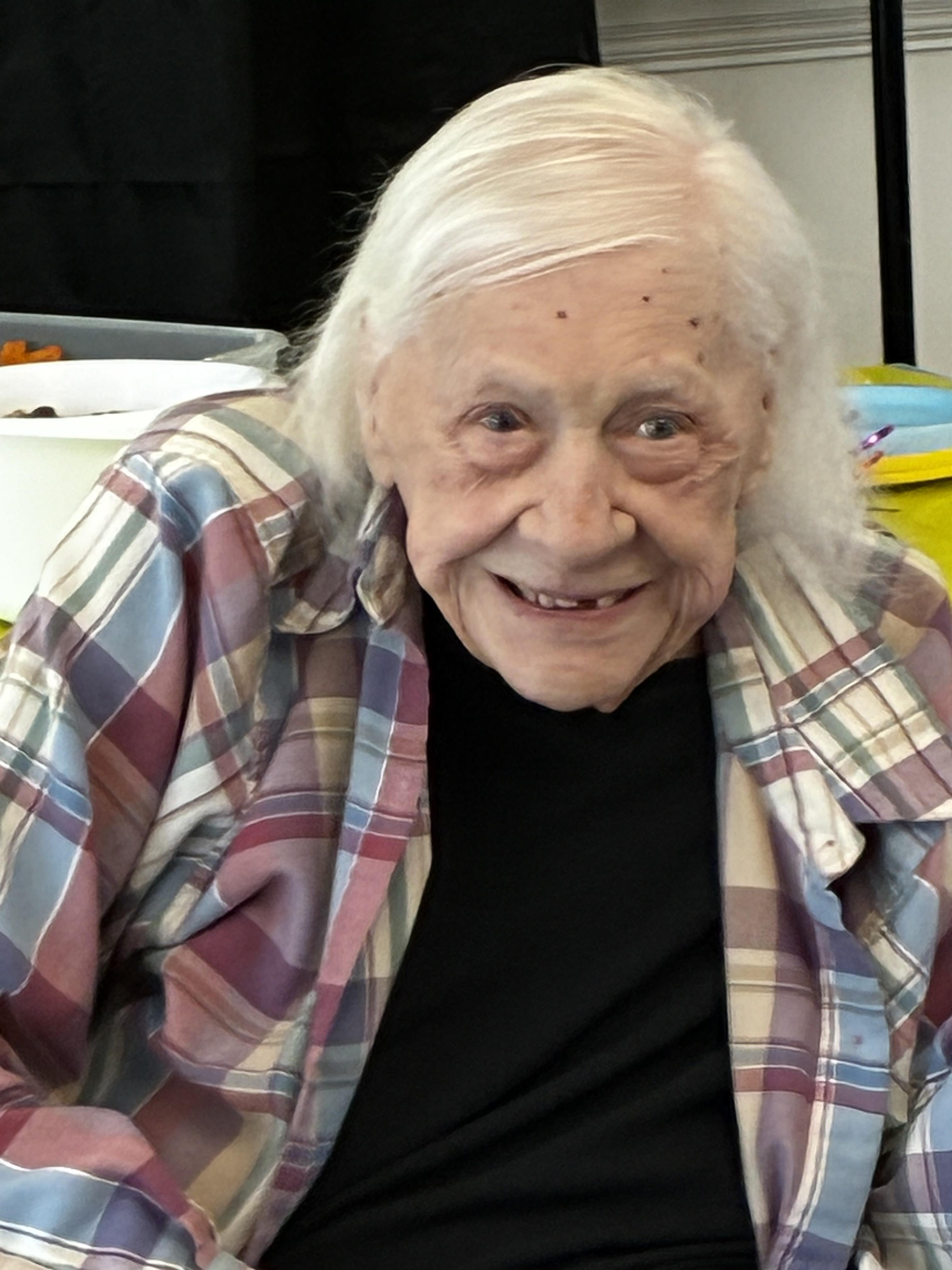 An old woman smiling at camera