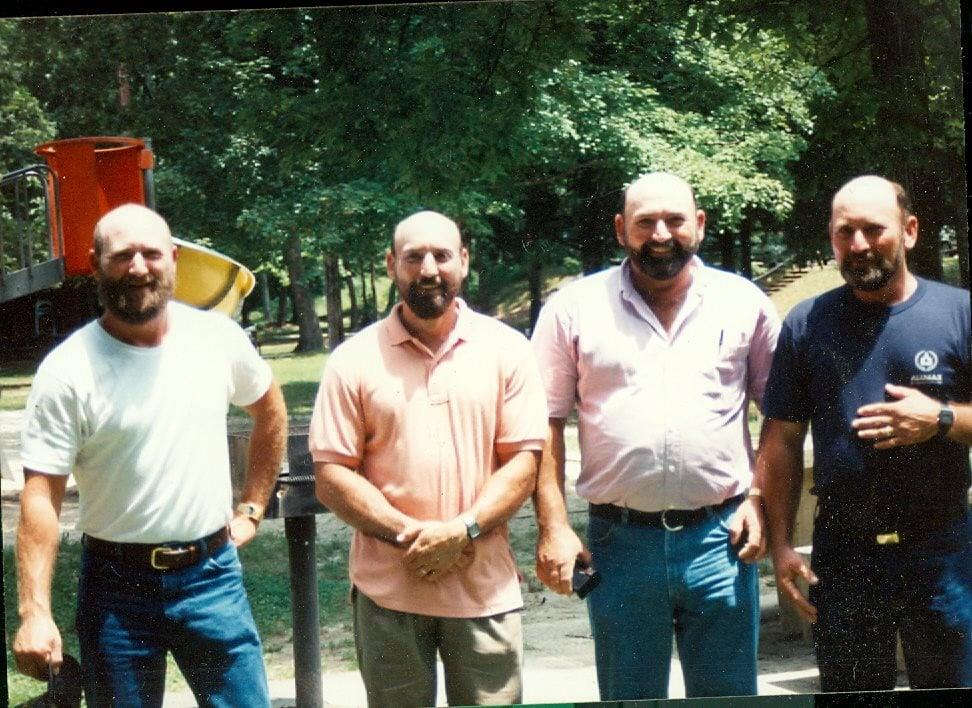 A group of men standing outside