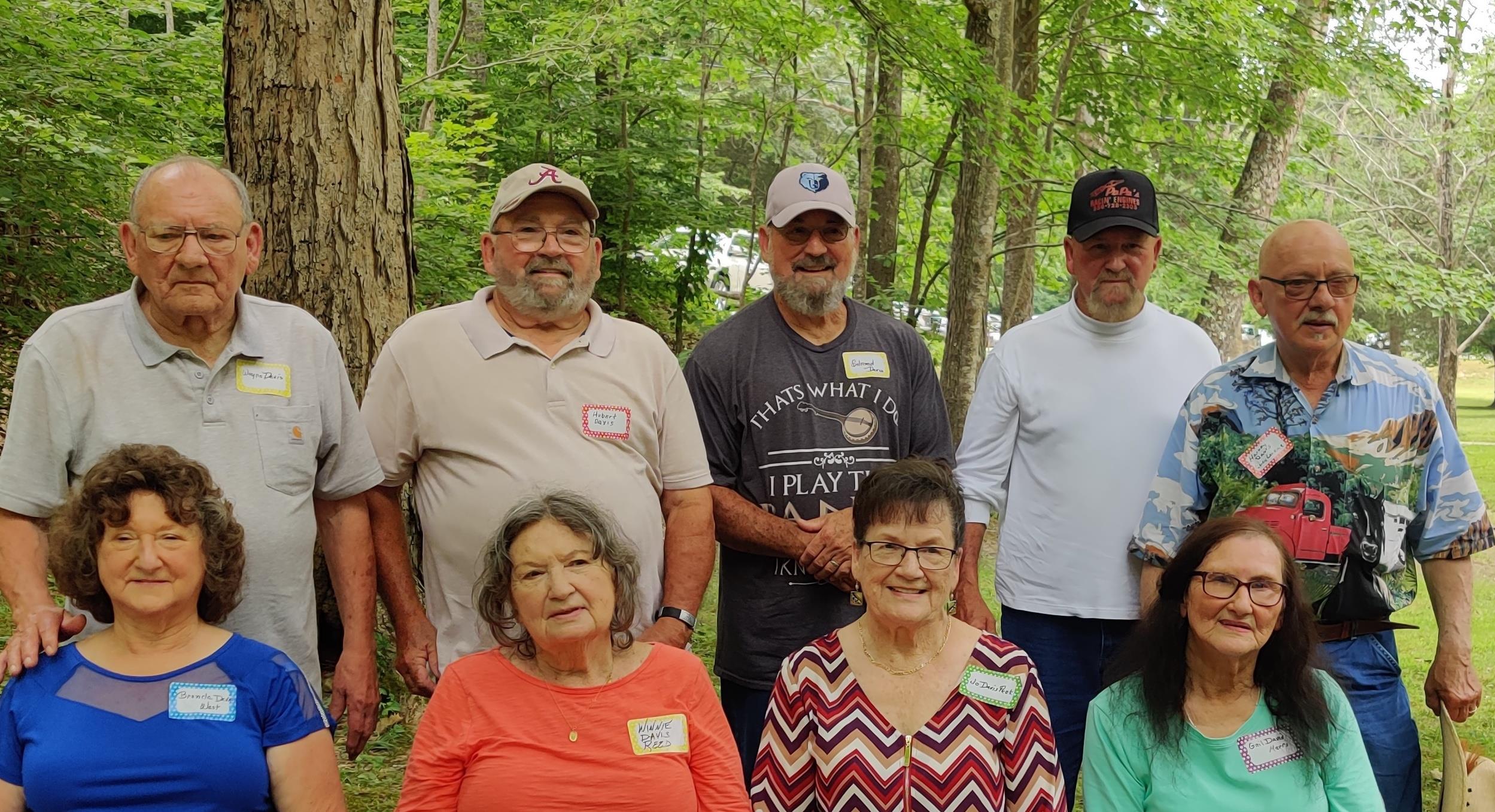 A group of people standing in a forest