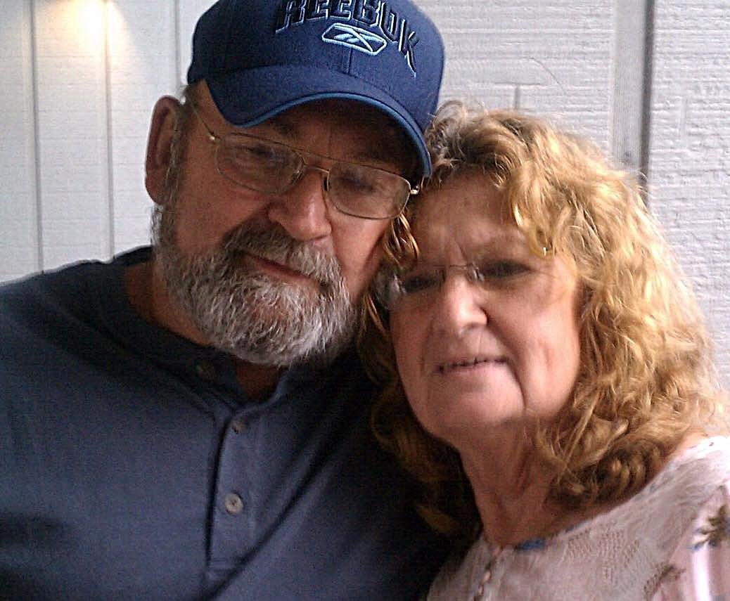 A man and woman posing for a picture