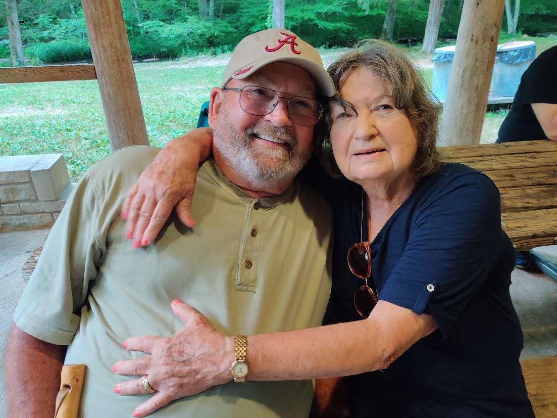 A man and woman sitting on a bench