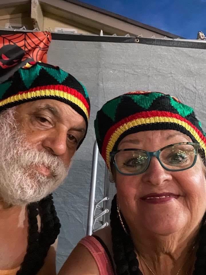 A man and woman wearing hats