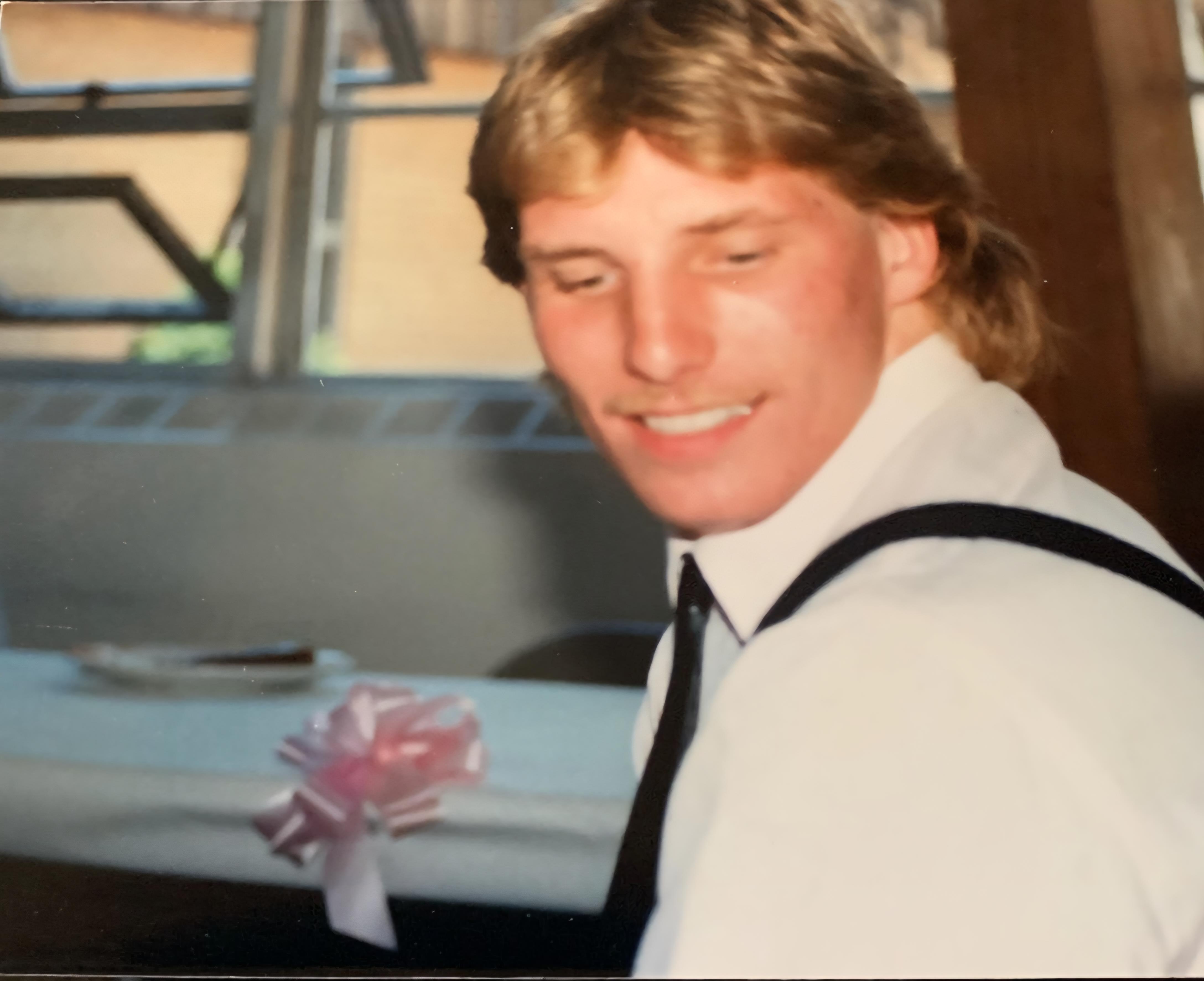 A man in a white shirt and tie