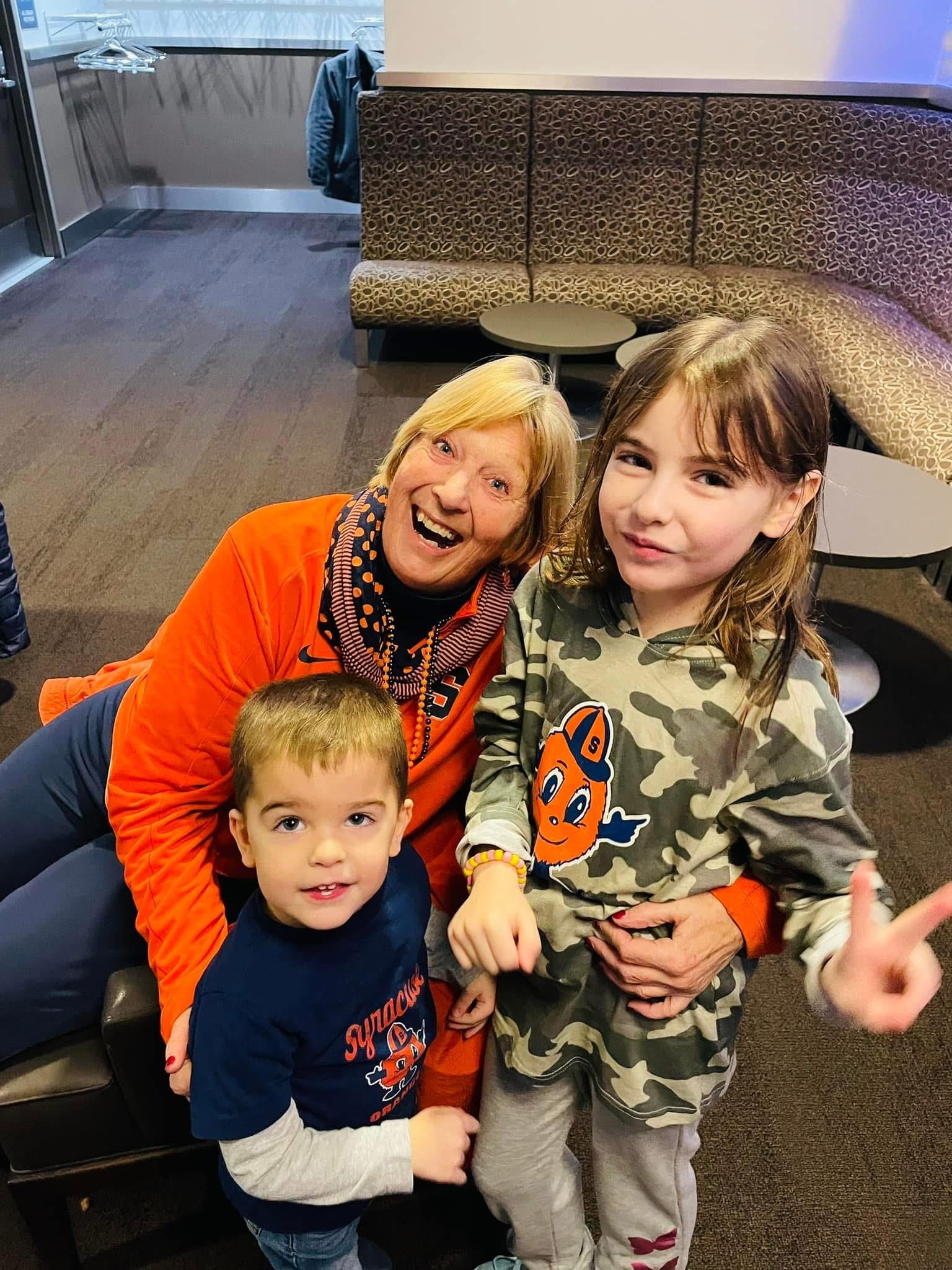 A woman and two children posing for a picture