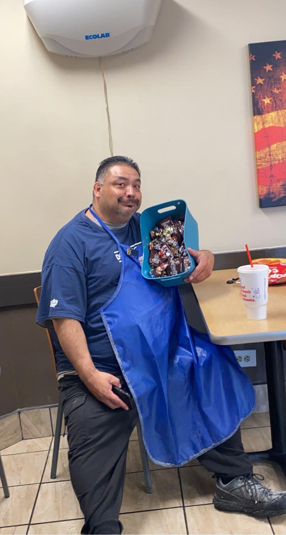 A man holding a basket of candy