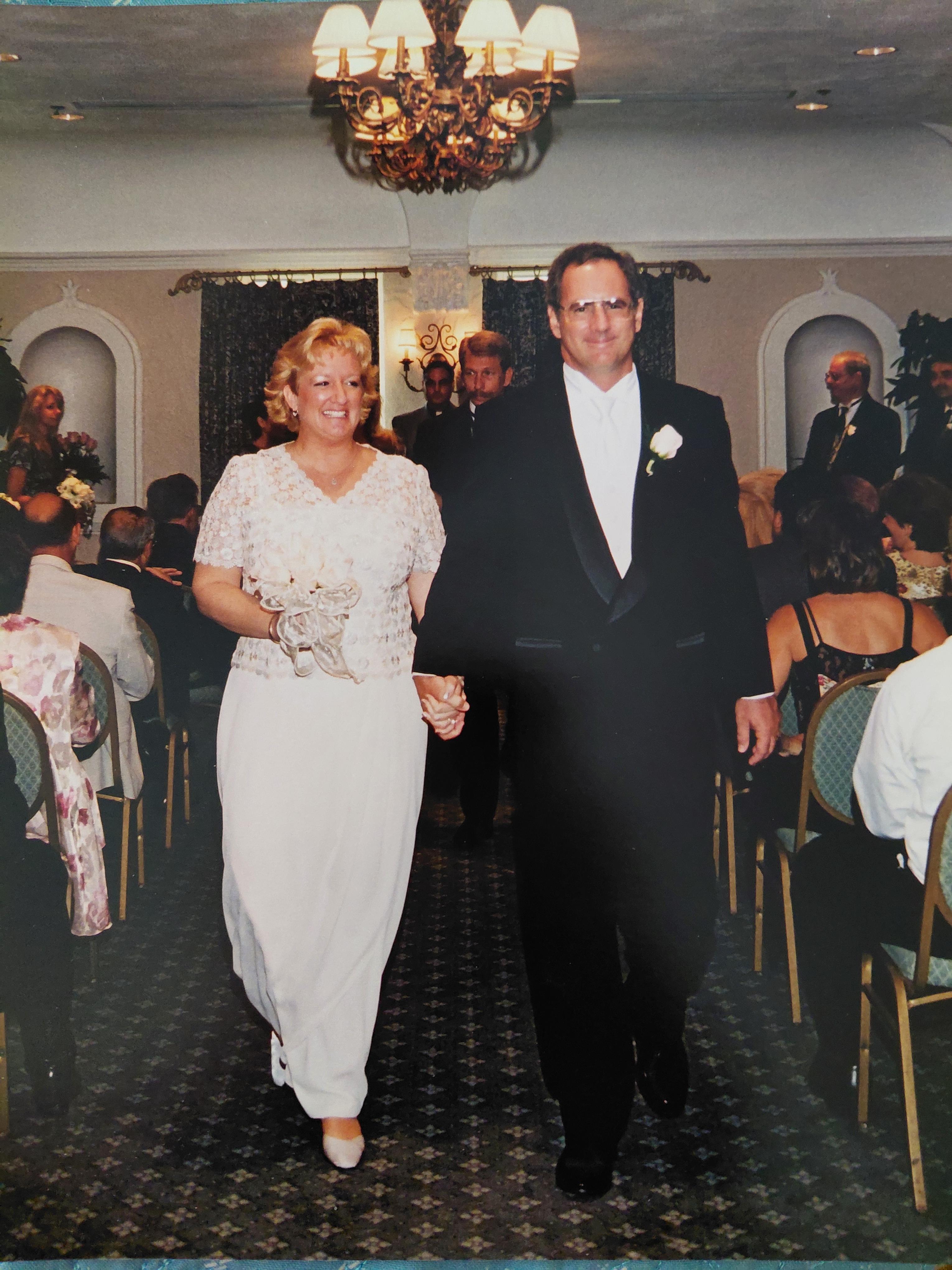 A man and woman holding hands
