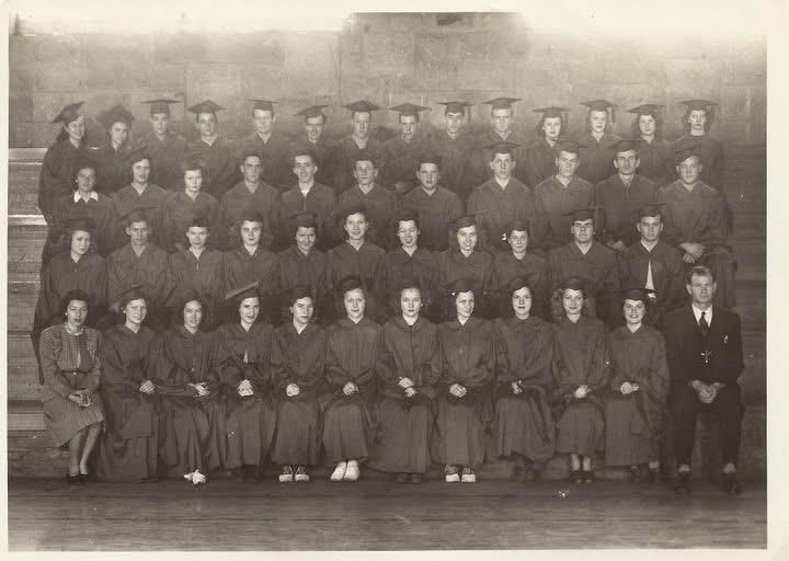 A group of graduates posing for a photo