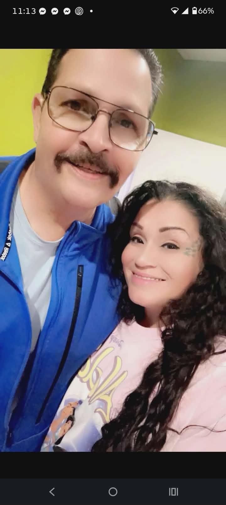 A man and woman taking a selfie