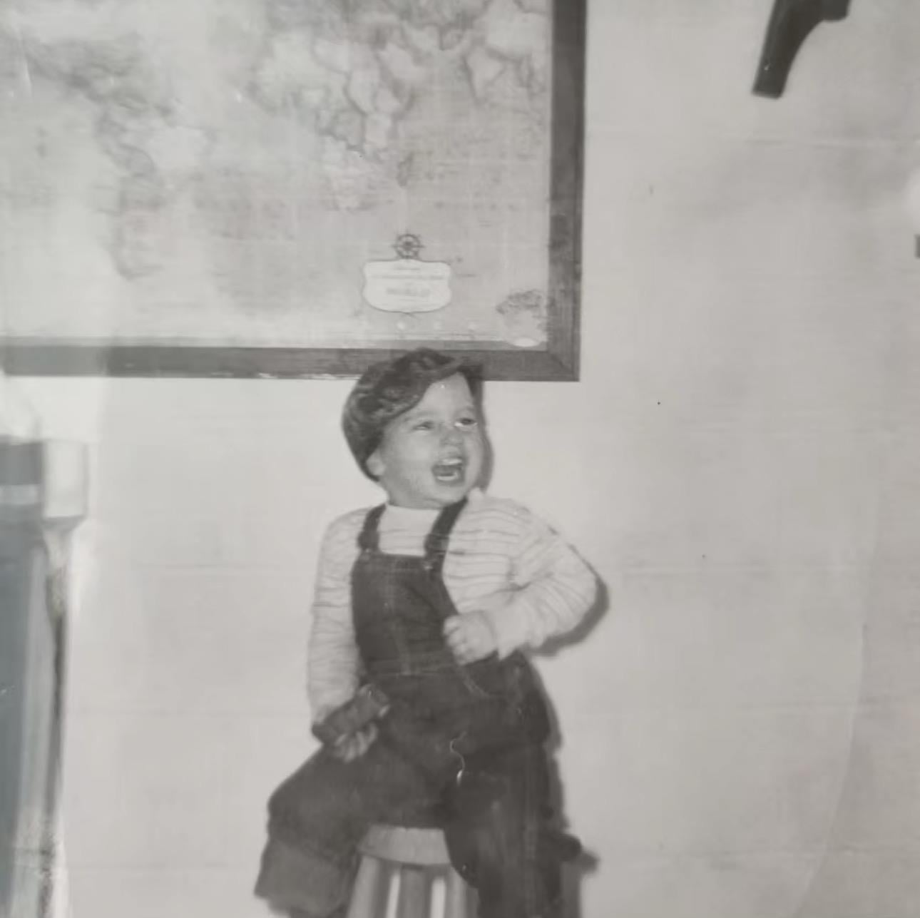 A child sitting on a stool