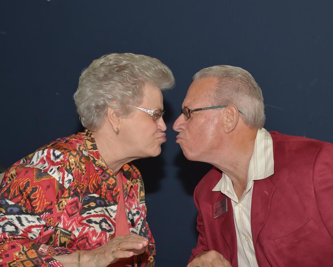 A man and woman kissing each other